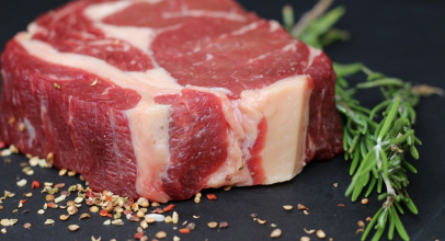 What does raw meat signify in a dream?